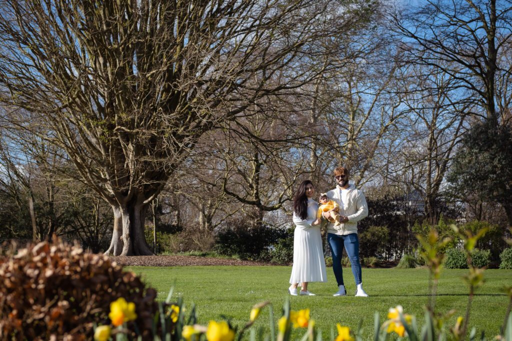 Outdoor spring family photo session, family of three in Hyde park rose gardens