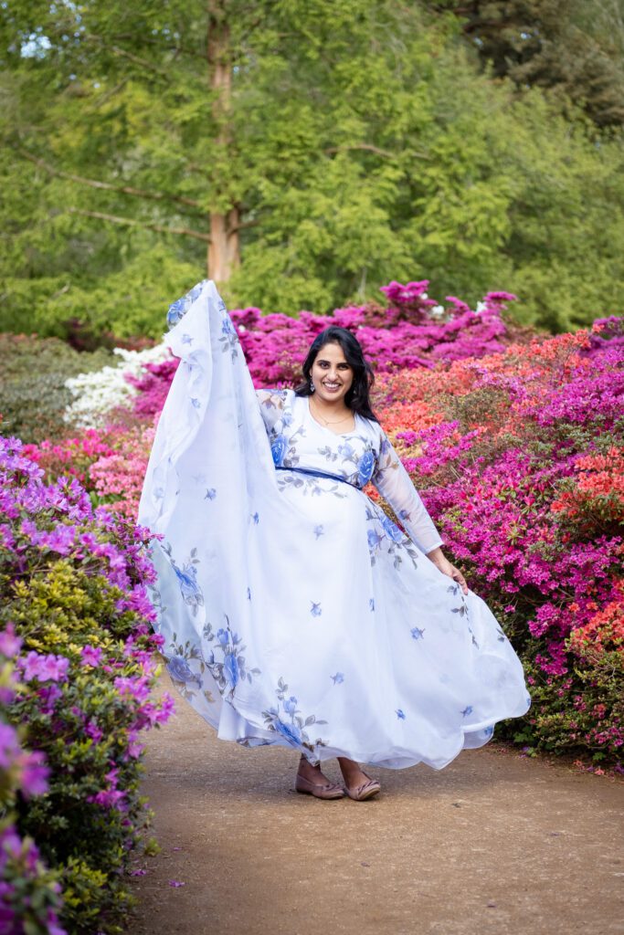 Pregnant woman around flowers at Isabella plantation in Richmond park