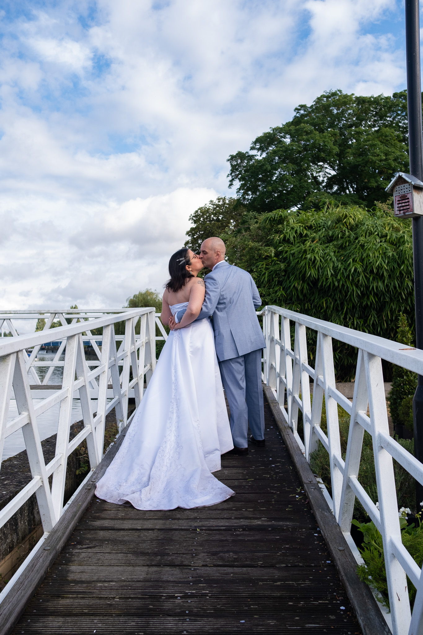 Groom and bride kissing, wedding photoshoot